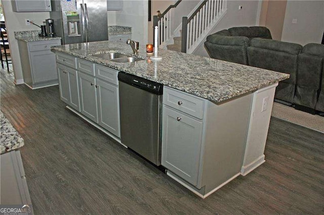 131 Queens Cemetery Rd, Good Hope, GA 30641 - kitchen with stainless steel appliances, dark wood-style flooring, a sink, and an island with sink