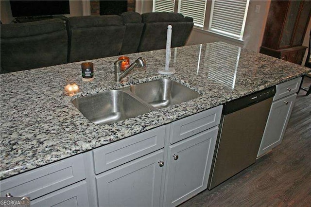 131 Queens Cemetery Rd, Good Hope, GA 30641 - kitchen with dishwasher, a sink, dark wood finished floors, and light stone counters
