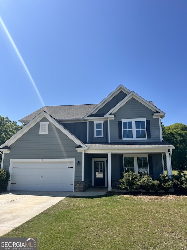 131 Queens Cemetery Rd, Good Hope, GA 30641 - craftsman inspired home with board and batten siding, a garage, covered porch, a front yard, and concrete driveway