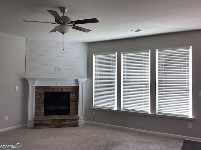 131 Queens Cemetery Rd, Good Hope, GA 30641 - unfurnished living room with carpet, ceiling fan, a fireplace, and baseboards
