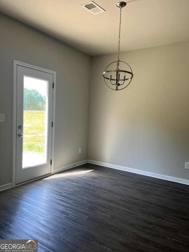 131 Queens Cemetery Rd, Good Hope, GA 30641 - spare room featuring a chandelier, dark wood-type flooring, and baseboards