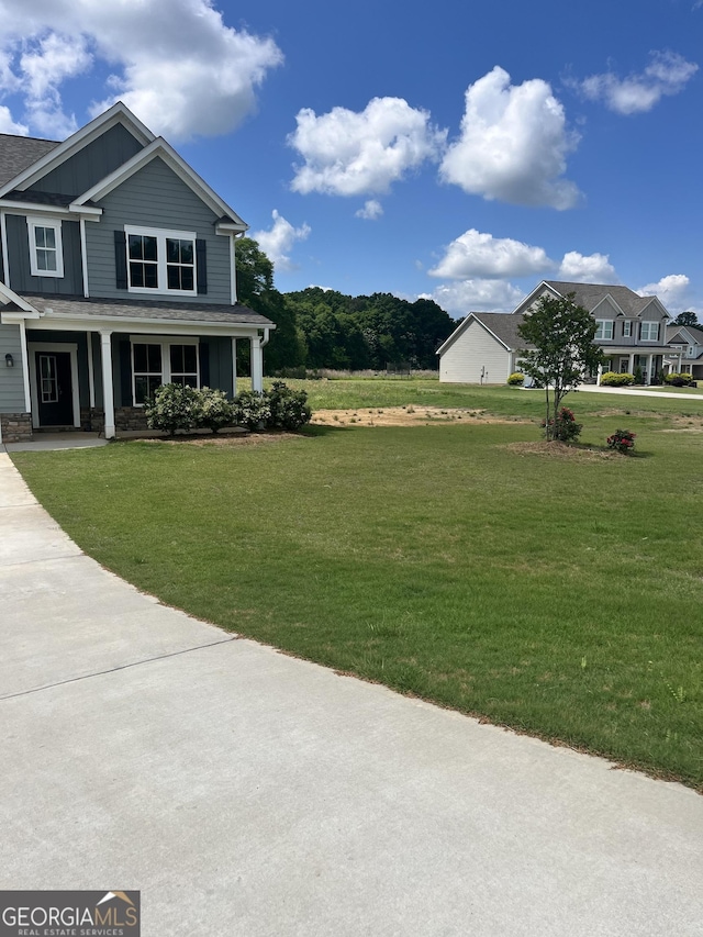 131 Queens Cemetery Rd, Good Hope, GA 30641 - view of green lawn featuring a porch