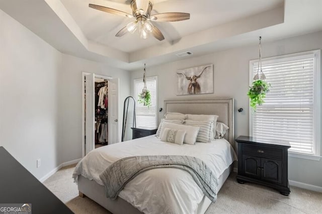 143 Treadstone Ln, Dallas, GA 30132 - bedroom featuring light colored carpet, a spacious closet, a raised ceiling, a closet, and ceiling fan