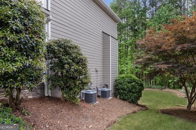 143 Treadstone Ln, Dallas, GA 30132 - view of side of property featuring a cooling unit and a lawn