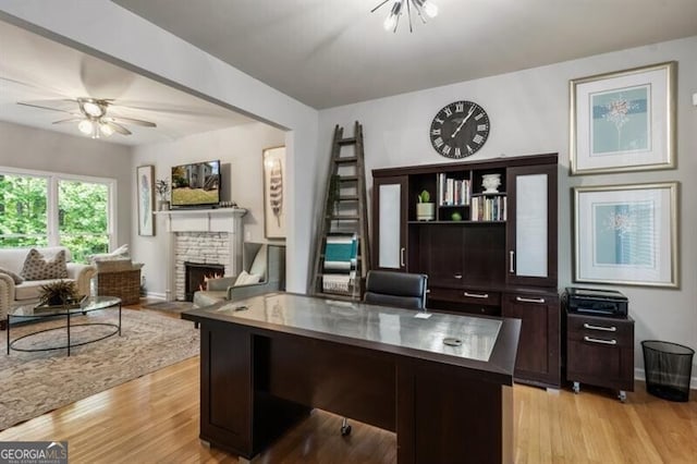 143 Treadstone Ln, Dallas, GA 30132 - office with light wood finished floors, a fireplace, and a ceiling fan