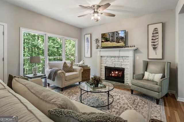 143 Treadstone Ln, Dallas, GA 30132 - living area featuring a ceiling fan, wood finished floors, and a fireplace