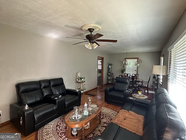 2059 Clearwater Dr SE, Marietta, GA 30067 - living area with ceiling fan, wood finished floors, baseboards, and a textured ceiling