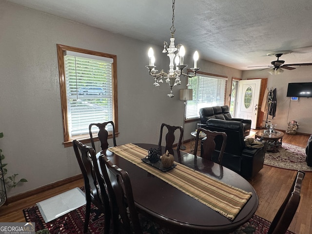 2059 Clearwater Dr SE, Marietta, GA 30067 - dining space with wood finished floors, baseboards, a chandelier, a textured ceiling, and ceiling fan