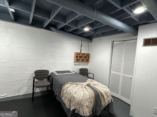 2059 Clearwater Dr SE, Marietta, GA 30067 - bedroom featuring finished concrete flooring and a closet