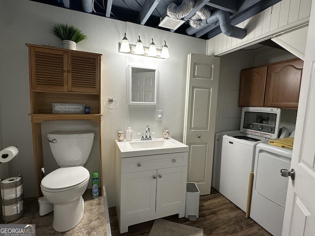 2059 Clearwater Dr SE, Marietta, GA 30067 - bathroom with independent washer and dryer, toilet, and vanity