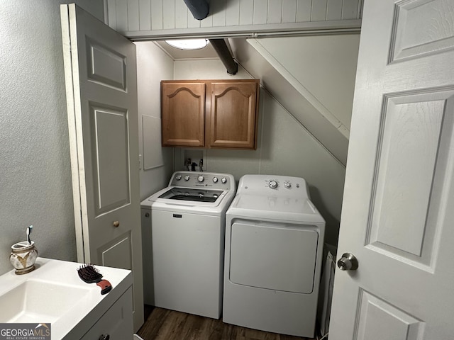 2059 Clearwater Dr SE, Marietta, GA 30067 - clothes washing area with cabinet space, washer and clothes dryer, and dark wood-style flooring