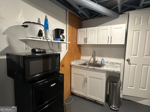 2059 Clearwater Dr SE, Marietta, GA 30067 - kitchen with a sink, white cabinets, open shelves, and black microwave