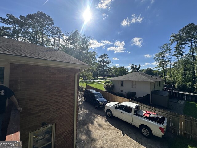 2059 Clearwater Dr SE, Marietta, GA 30067 - view of home's exterior featuring fence and brick siding