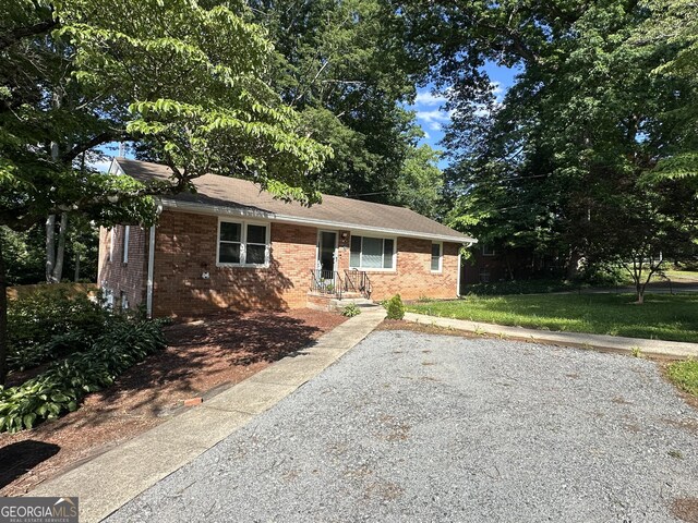 2059 Clearwater Dr SE, Marietta, GA 30067 - view of front of property with brick siding and a front lawn