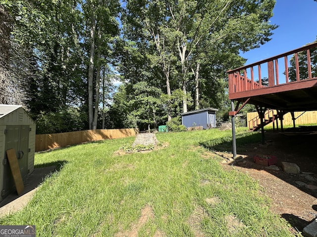 2059 Clearwater Dr SE, Marietta, GA 30067 - view of yard with a storage shed, a deck, and an outdoor structure