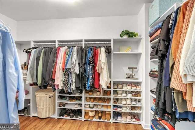 3477 Seneca Farm Dr, Buford, GA 30519 - walk in closet featuring wood finished floors