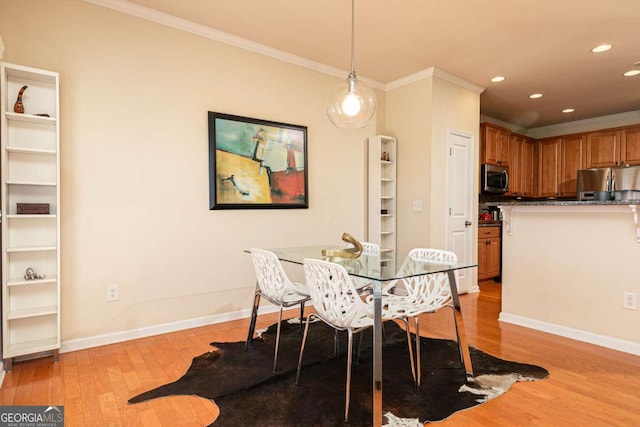5888 Cobblestone Creek Cir, Mableton, GA 30126 - dining area featuring crown molding, light wood finished floors, recessed lighting, and baseboards
