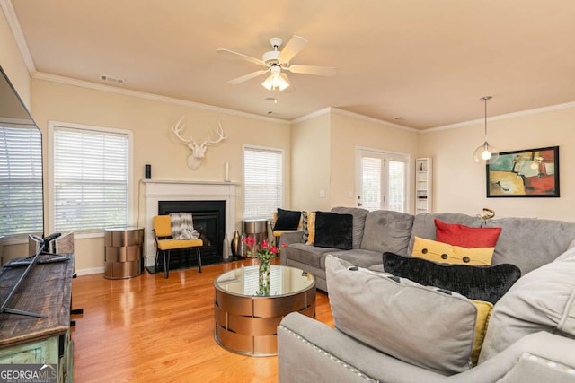 5888 Cobblestone Creek Cir, Mableton, GA 30126 - living room featuring wood finished floors, ceiling fan, a fireplace with flush hearth, crown molding, and baseboards