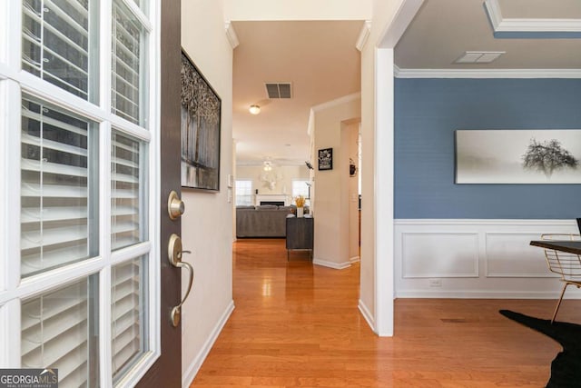 5888 Cobblestone Creek Cir, Mableton, GA 30126 - hall featuring wood finished floors, crown molding, wainscoting, and baseboards