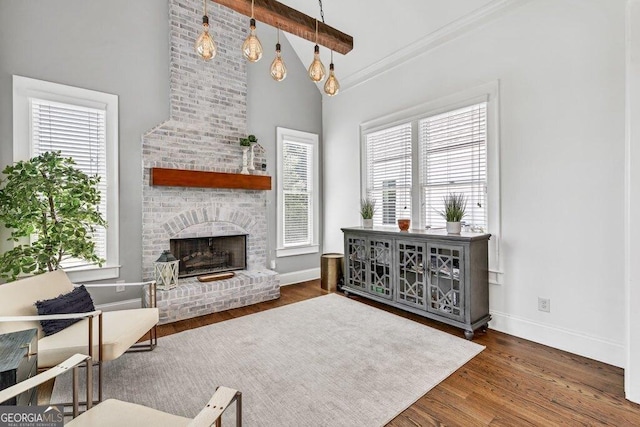 5461 Autumn Flame Dr, Braselton, GA 30517 - living area with plenty of natural light, baseboards, wood finished floors, beam ceiling, and high vaulted ceiling