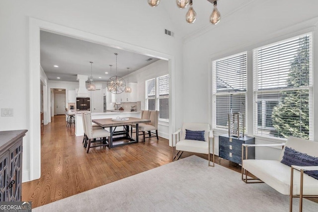 5461 Autumn Flame Dr, Braselton, GA 30517 - dining space with wood finished floors, a chandelier, recessed lighting, and baseboards