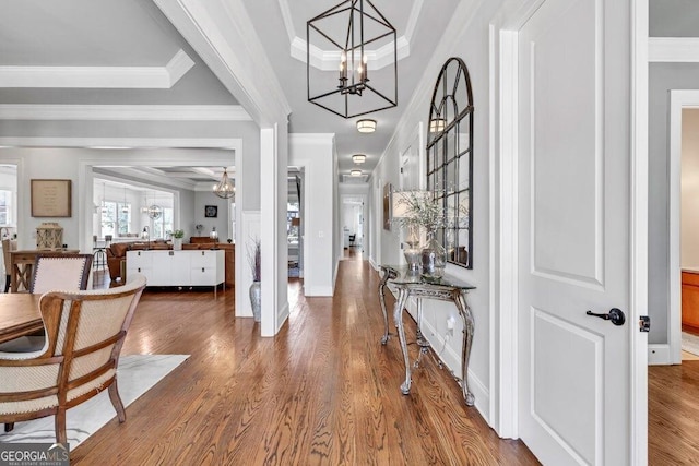 5461 Autumn Flame Dr, Braselton, GA 30517 - foyer featuring a chandelier, wood finished floors, and crown molding