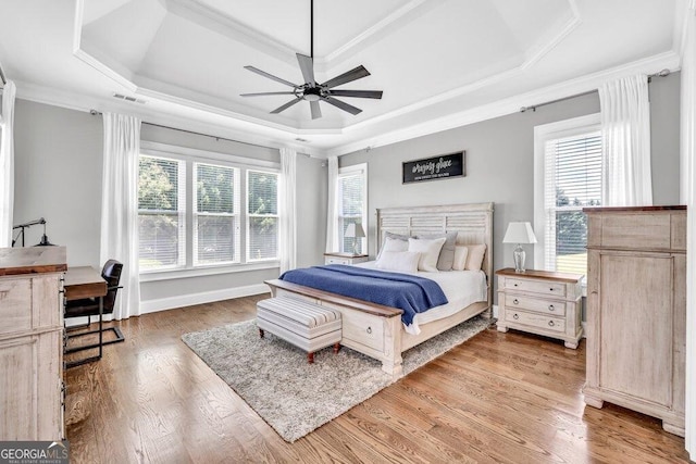 5461 Autumn Flame Dr, Braselton, GA 30517 - bedroom featuring a raised ceiling, ornamental molding, wood finished floors, and a ceiling fan