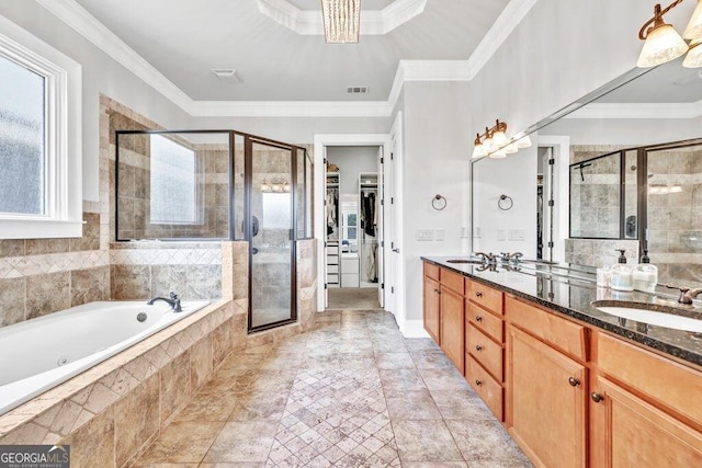 5461 Autumn Flame Dr, Braselton, GA 30517 - full bath featuring a shower stall, double vanity, a garden tub, a walk in closet, and crown molding