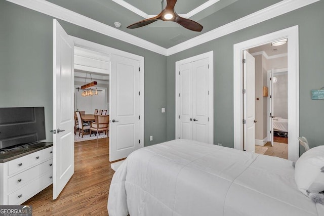 5461 Autumn Flame Dr, Braselton, GA 30517 - bedroom featuring ornamental molding, light wood-style flooring, a closet, a ceiling fan, and baseboards