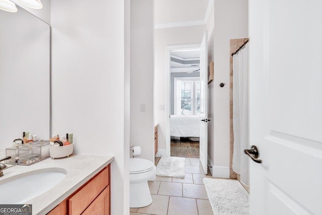 5461 Autumn Flame Dr, Braselton, GA 30517 - ensuite bathroom with crown molding, vanity, toilet, tile patterned floors, and a shower with shower curtain