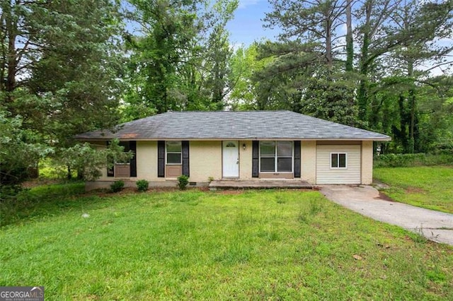 8169 Kendrick Rd, Jonesboro, GA 30238 - ranch-style home featuring brick siding, a front yard, and a shingled roof