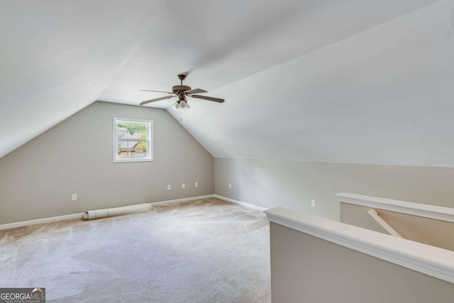 bonus room featuring a ceiling fan, carpet floors, vaulted ceiling, and baseboards