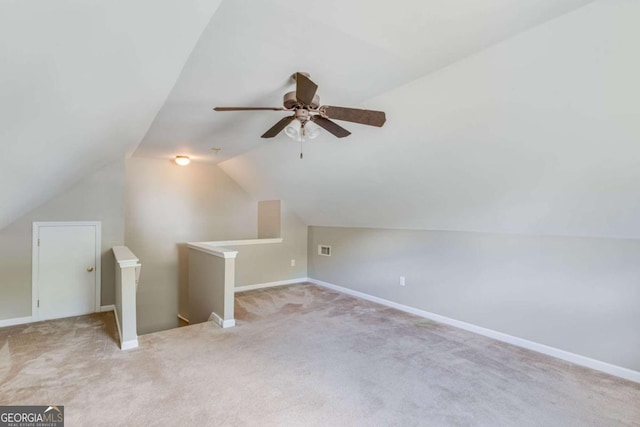 bonus room with lofted ceiling, carpet, ceiling fan, and baseboards