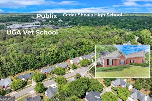 aerial perspective of suburban area with a heavily wooded area