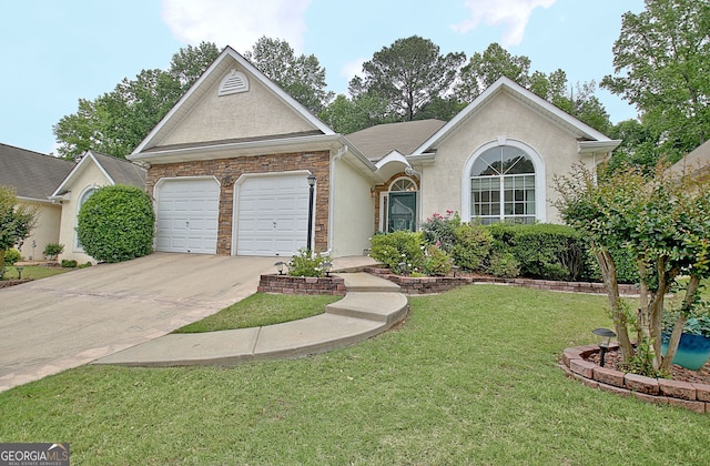 323 Newfield Way, Peachtree City, GA 30269 - view of front of property featuring driveway, stucco siding, a front yard, and a garage