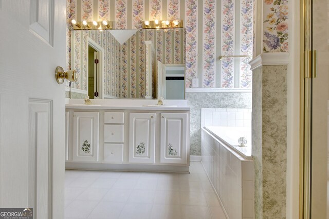 323 Newfield Way, Peachtree City, GA 30269 - bathroom with wallpapered walls, a chandelier, a garden tub, double vanity, and tile patterned flooring