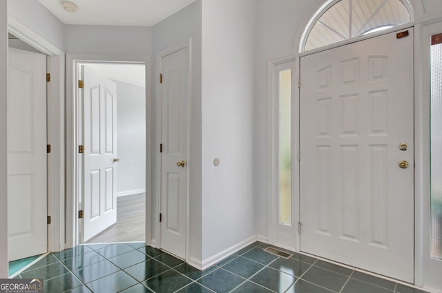 323 Newfield Way, Peachtree City, GA 30269 - foyer featuring dark tile patterned floors and baseboards