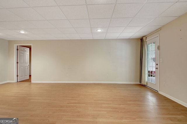 323 Newfield Way, Peachtree City, GA 30269 - unfurnished living room featuring light wood-type flooring, baseboards, a drop ceiling, and recessed lighting