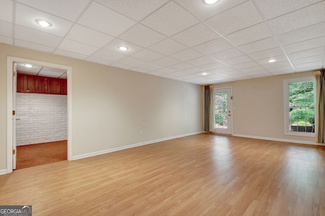 323 Newfield Way, Peachtree City, GA 30269 - unfurnished living room featuring a drop ceiling, light wood finished floors, baseboards, and recessed lighting