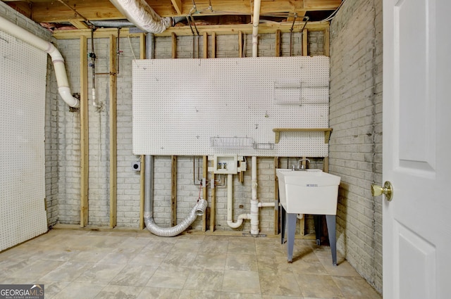 323 Newfield Way, Peachtree City, GA 30269 - unfinished below grade area featuring brick wall