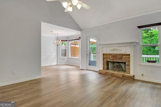 323 Newfield Way, Peachtree City, GA 30269 - unfurnished living room featuring healthy amount of natural light, a chandelier, ceiling fan, wood finished floors, and high vaulted ceiling