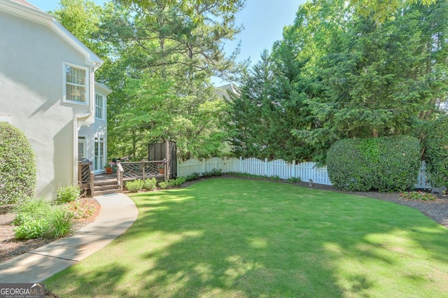 view of yard with a deck