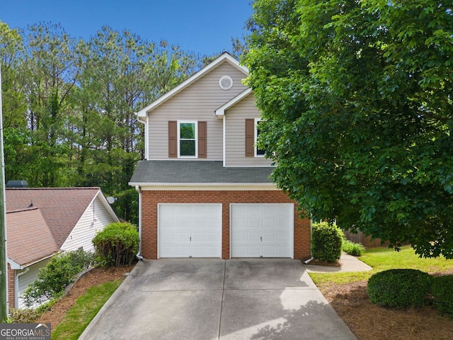 164 Stoneforest Dr, Woodstock, GA 30189 - view of front of property featuring driveway, an attached garage, and brick siding