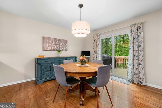164 Stoneforest Dr, Woodstock, GA 30189 - dining area with baseboards and light wood-type flooring