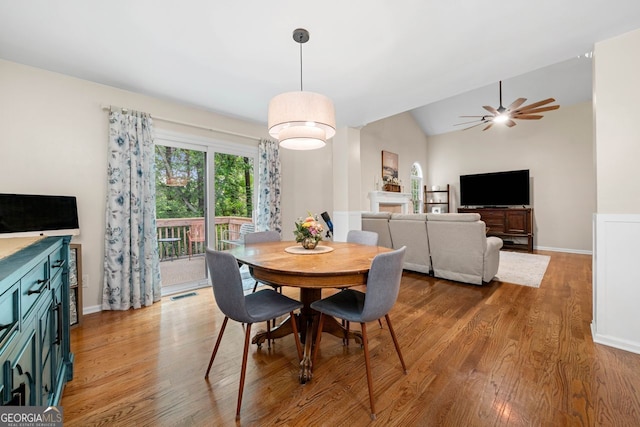 164 Stoneforest Dr, Woodstock, GA 30189 - dining area with wood finished floors, ceiling fan, and lofted ceiling