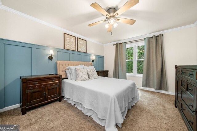 164 Stoneforest Dr, Woodstock, GA 30189 - bedroom featuring crown molding, light colored carpet, a ceiling fan, and a decorative wall