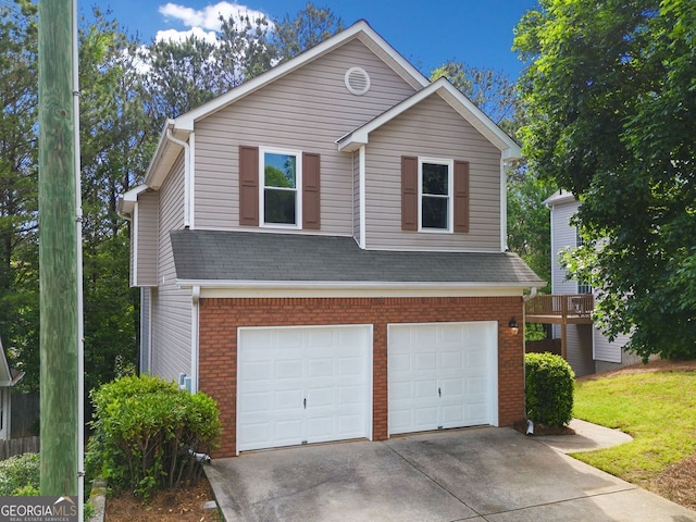 164 Stoneforest Dr, Woodstock, GA 30189 - view of front of home with a garage, brick siding, and driveway
