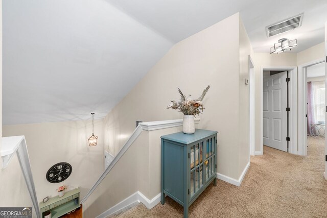 164 Stoneforest Dr, Woodstock, GA 30189 - hallway featuring carpet flooring, an upstairs landing, and vaulted ceiling