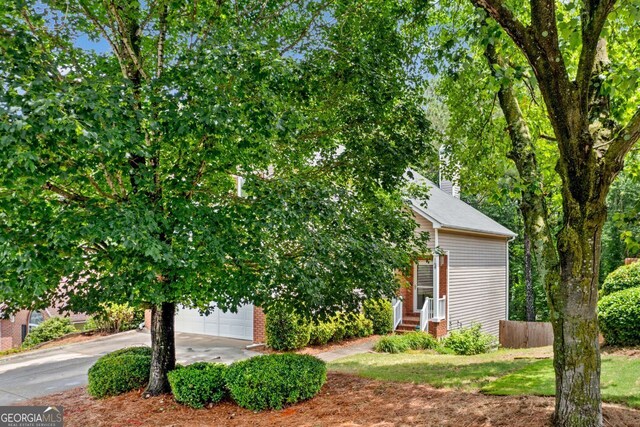 164 Stoneforest Dr, Woodstock, GA 30189 - obstructed view of property with driveway