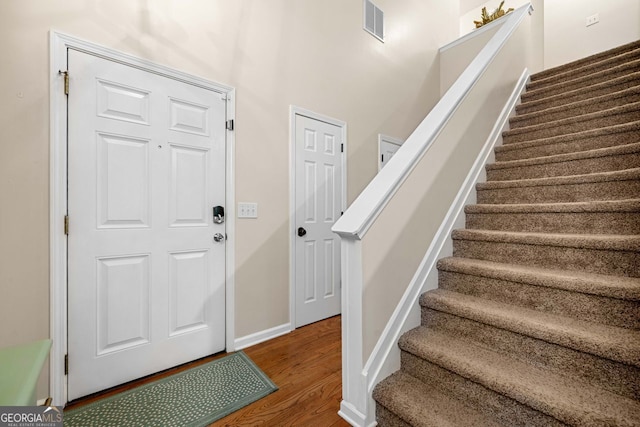 164 Stoneforest Dr, Woodstock, GA 30189 - foyer entrance with stairs and wood finished floors